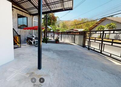 Outdoor area with covered patio and parking space