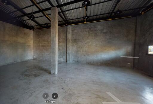 Unfinished interior space with concrete floors and walls