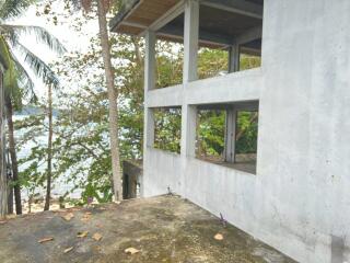 Unfinished building with ocean view