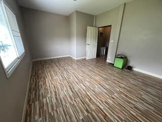 Empty bedroom with wooden floor