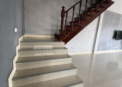 Indoor staircase with wooden steps and railing