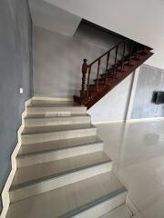 Indoor staircase with wooden steps and railing