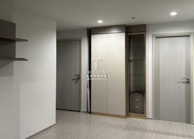 Modern apartment entrance with closed doors and built-in storage