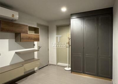 Modern bedroom with built-in storage and air conditioning