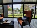 Modern living room with large windows and garden view