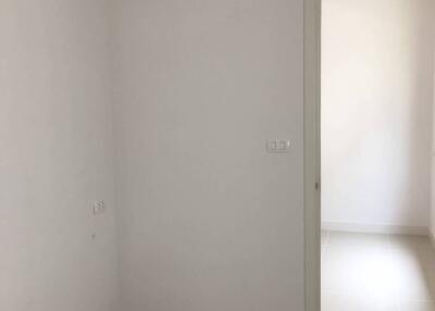 Small empty room with open door