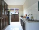 Well-lit kitchen featuring appliances and storage cabinets