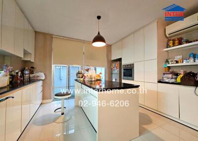 Modern kitchen with island and white cabinets