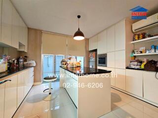 Modern kitchen with island and white cabinets