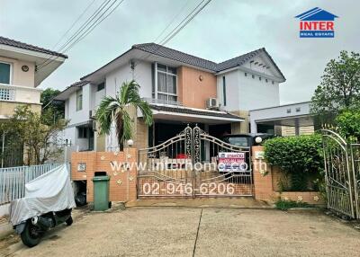 Two-story house with gated entrance