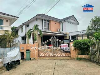 Two-story house with gated entrance