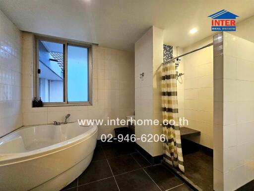 Bathroom with bathtub and shower