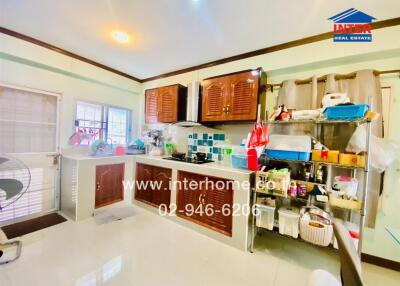 Spacious kitchen with modern fixtures and ample storage