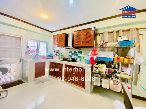 Spacious kitchen with modern fixtures and ample storage