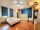 Bedroom with wooden flooring and modern ceiling light