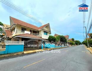 Exterior view of a residential house and street