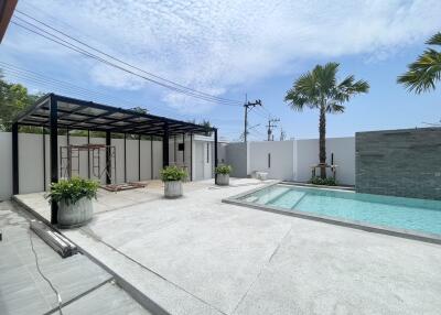 Modern patio with swimming pool and seating area
