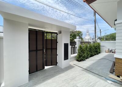 Front entrance with gate and driveway