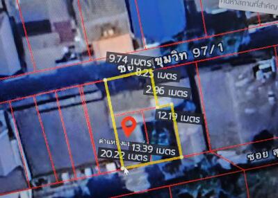 Aerial view of a property with outlined measurements and pin location