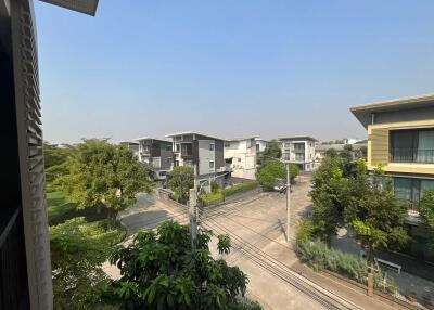 View of residential buildings and street from a higher floor