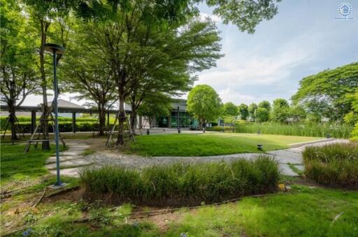 Exterior view of a modern building surrounded by greenery and pathways