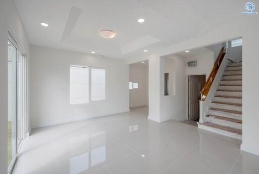 Spacious and modern living room with staircase