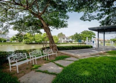 Beautiful outdoor area with bench seating and greenery