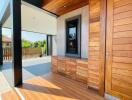 Main entrance with wooden door and accent walls