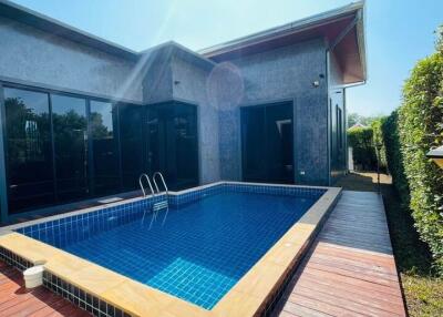 Outdoor swimming pool with wooden deck