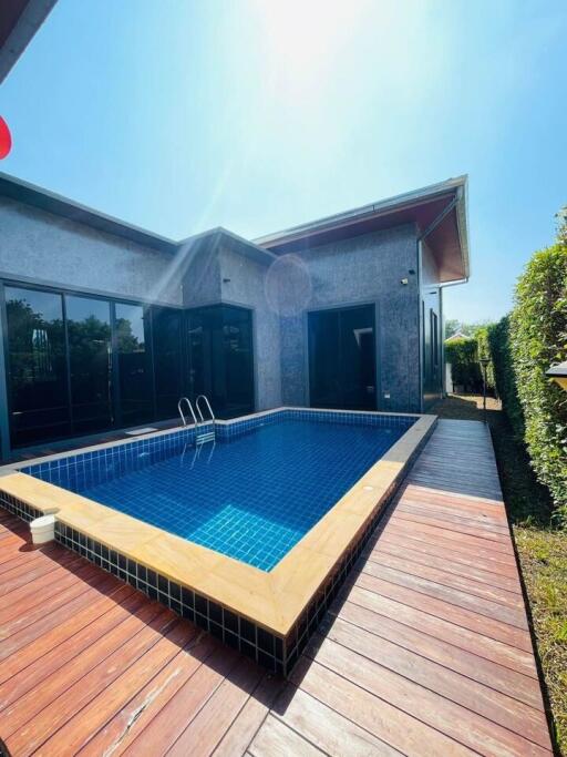 Outdoor swimming pool with wooden deck