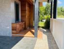 Modern outdoor entryway with wooden and concrete elements