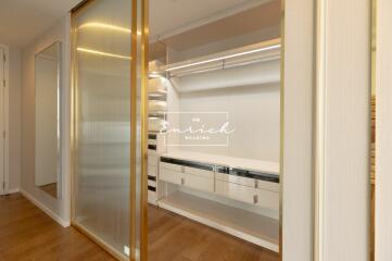 Walk-in closet with built-in drawers and shelving