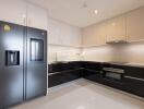 Modern kitchen with sleek black and white cabinetry