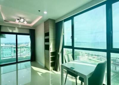 Bright living area with large windows and ocean view