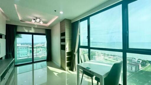 Bright living area with large windows and ocean view