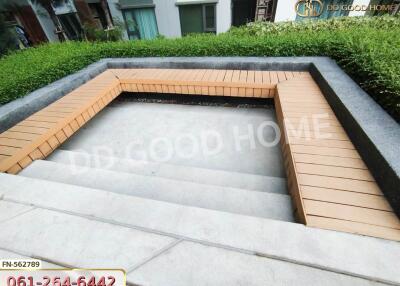 Outdoor seating area with wooden benches and steps