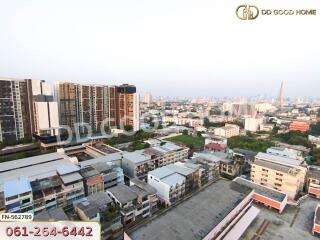 Aerial view of a city with buildings and apartments