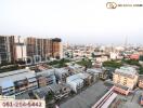 Aerial view of a city with buildings and apartments