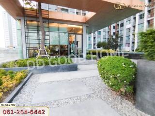 Modern building entrance with greenery