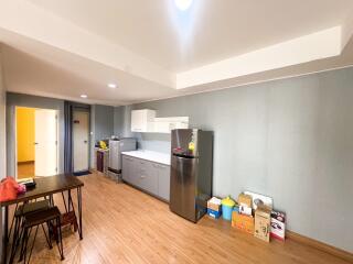 Spacious kitchen area with dining table and modern appliances