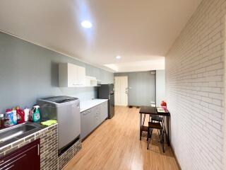 Modern kitchen with appliances and a small dining area