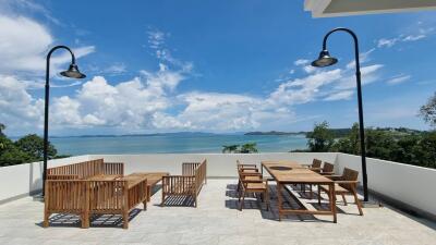 Outdoor terrace with seating and ocean view