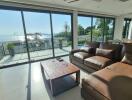 Spacious living room with large windows and a sea view