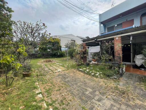 Outdoor area with garden and house