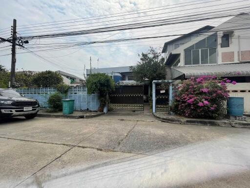 Exterior view of the property with a driveway and a garden