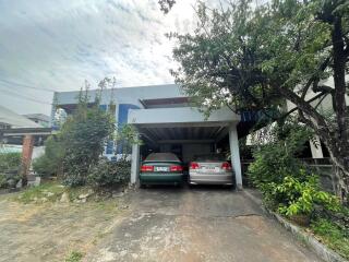 Driveway and carport with two cars