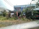 Two-story house with garden and attached carport