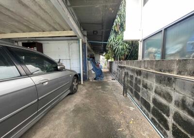 Covered carport with a parked car