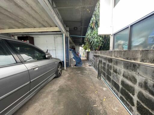 Covered carport with a parked car