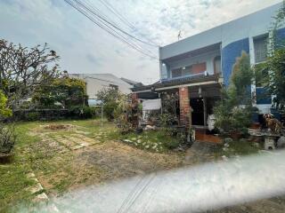 Exterior view of a house with a garden